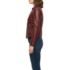 Brown leather jacket worn by a person on a white background