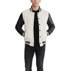 Man wearing a white and black varsity jacket on a white background
