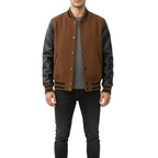 Man wearing a brown and black varsity jacket on a white background