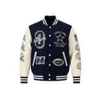 Navy and beige varsity jacket with embroidered logos on a white background