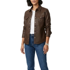 Woman wearing a brown leather jacket and blue jeans on a white background