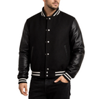 Black varsity jacket with leather sleeves worn by a person on a white background