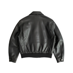 Black leather jacket on a white background with a brand logo.